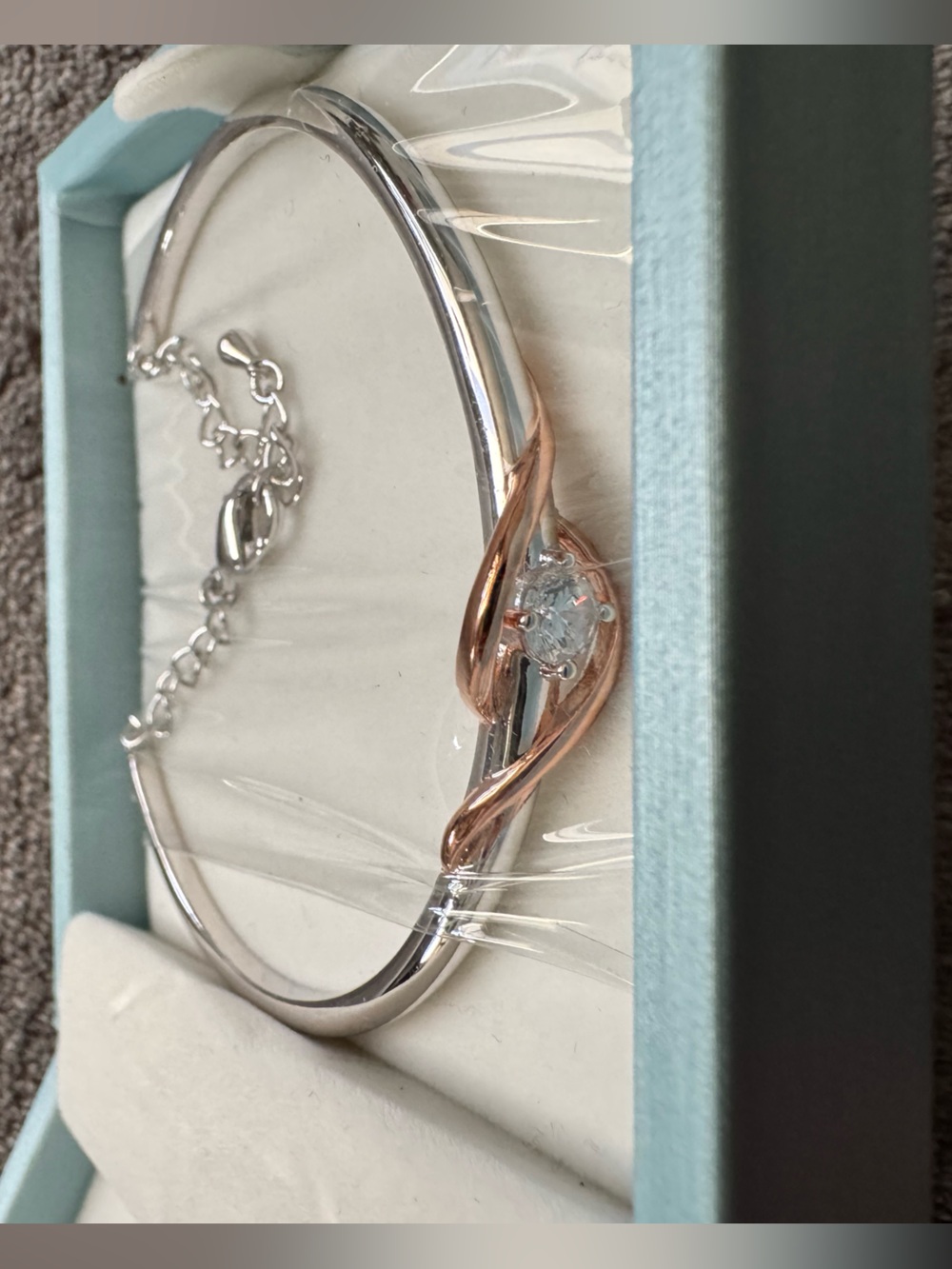 Rose Gold Accent Silver Bangle Bracelet with Clear Stone